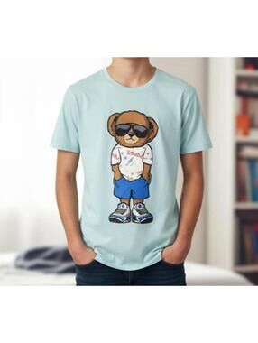 TOP Light Blue Graphic Bear Print T-Shirt BY BAILEY APPAREL SIZE MED